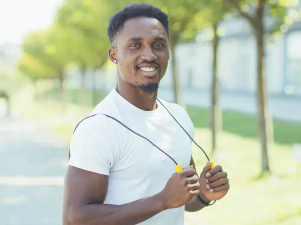 ISSA Trainer smiling at his phone