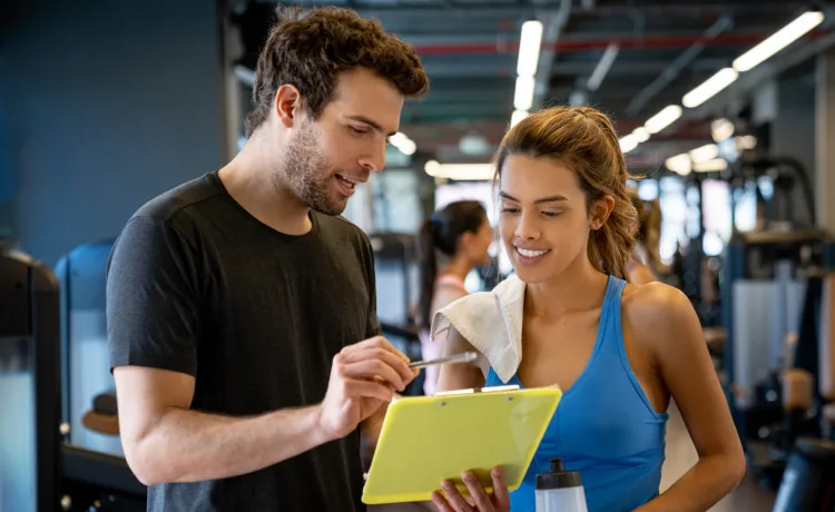 Precision Nutritionists covering training program with a clipboard