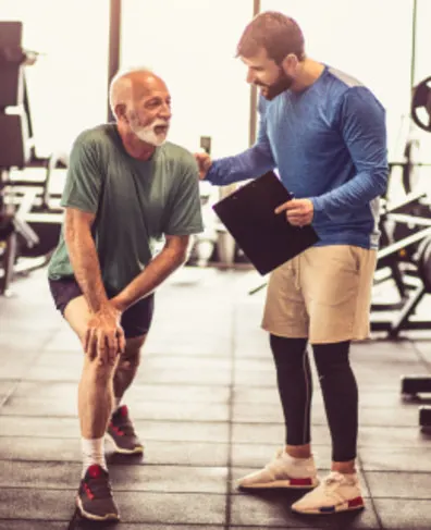 Senior Fitness Instructors laughing and stretching
